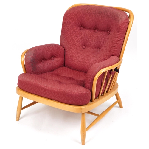 1071 - Ercol light elm Jubilee stick back armchair with red fleur de lis upholstered cushioned seats, 83cm ... 