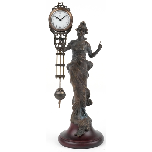 592 - Patinated spelter mystery clock in the form of an Art Nouveau maiden, 33.5cm high