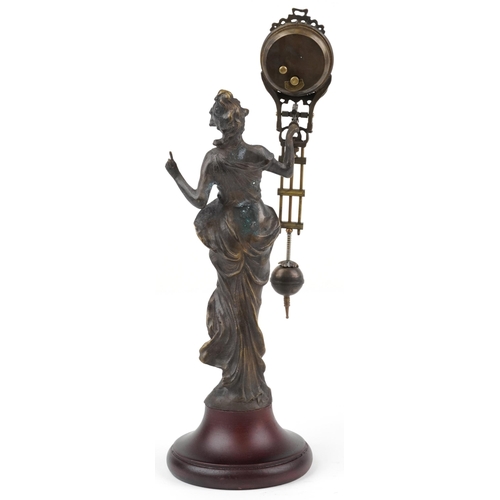 592 - Patinated spelter mystery clock in the form of an Art Nouveau maiden, 33.5cm high