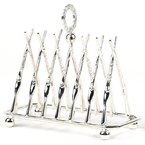 1870 - Military interest rifle design silver plated  six slice toast rack, 20cm in length