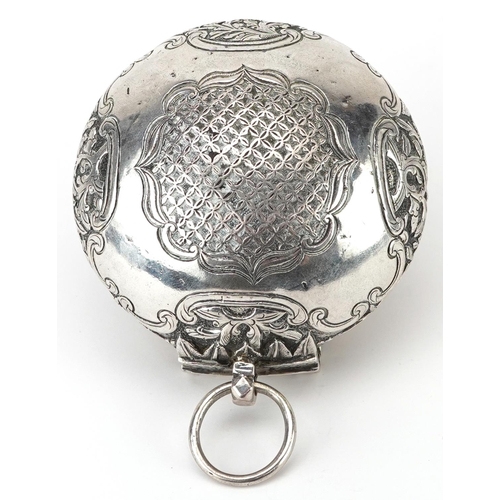 299 - Tibetan unmarked silver bun shaped box with hinged lid profusely embossed with flowers and foliage, ... 