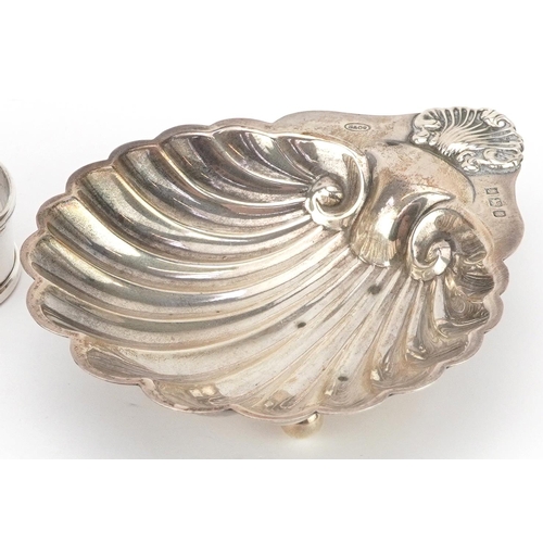 176 - Edwardian and later silver objects comprising five napkin rings, butter knife and shell shaped dish ... 