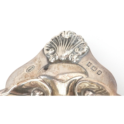 176 - Edwardian and later silver objects comprising five napkin rings, butter knife and shell shaped dish ... 