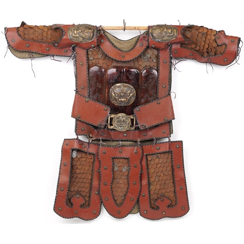 Japanese warrior's leather and lacquered metal suit of armour with applied bronzed dragon head design mounts, 127cm high x 146cm wide