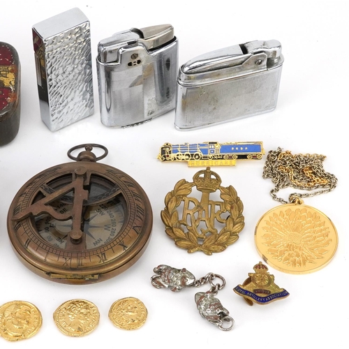 1284 - Sundry items including military cap badges, pocket lighters, a silver gilt pendant on necklace and a... 