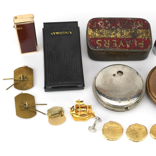 1284 - Sundry items including military cap badges, pocket lighters, a silver gilt pendant on necklace and a... 