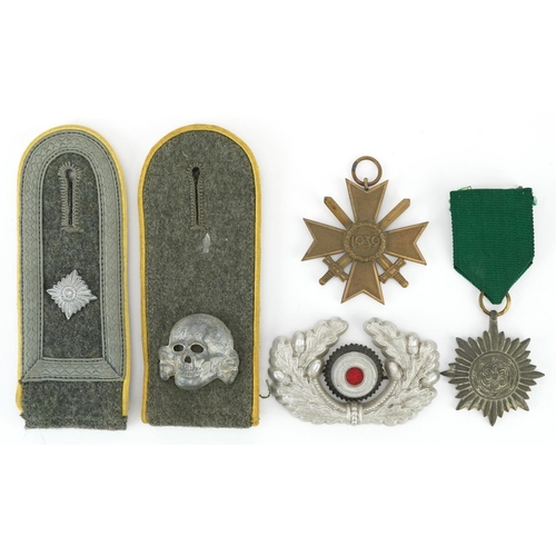 1835 - German militaria including a Waffen SS Totenkopf epaulet, army visor cap cockade, Ostbolk medal and ... 