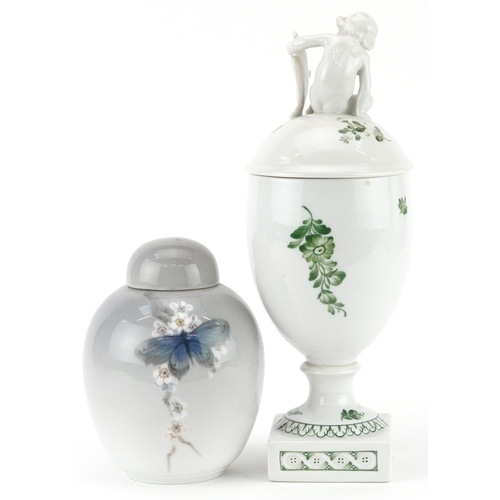 457 - Royal Copenhagen, Danish porcelain comprising a vase and cover surmounted with Putti and a jar and c... 