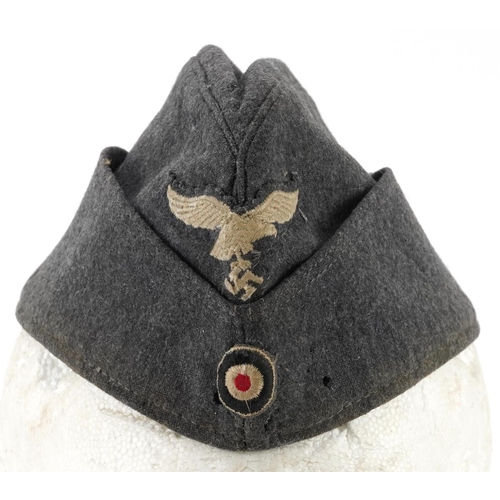 1883 - German military interest Luftwaffe overseas cap with eagle cloth badge, stamp to the interior