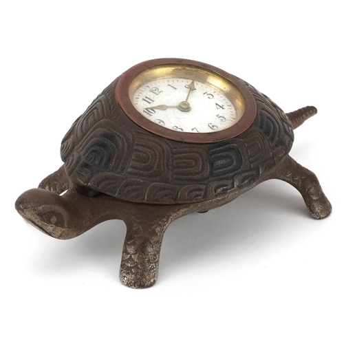 Victorian iron desk clock in the form of a turtle with enamelled dial having Arabic numerals, 17cm wide