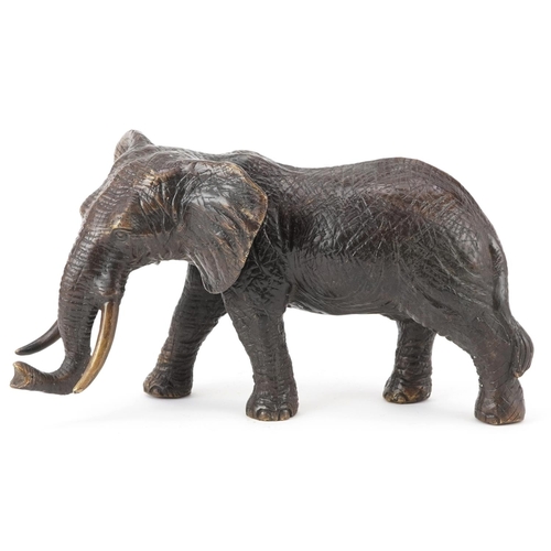 625 - Japanese patinated okimono of a bull elephant, 30cm in length