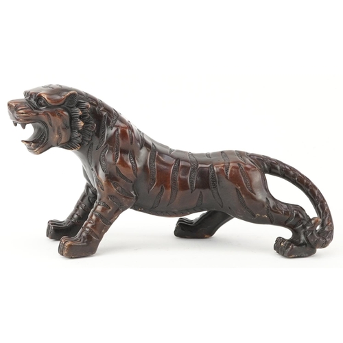 435 - Japanese patinated bronze okimono of a tiger, 35cm in length