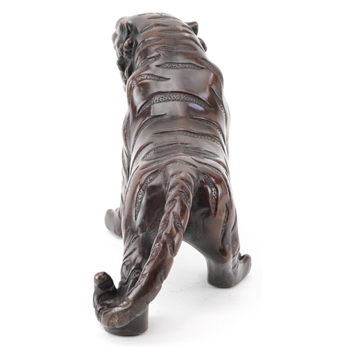 435 - Japanese patinated bronze okimono of a tiger, 35cm in length