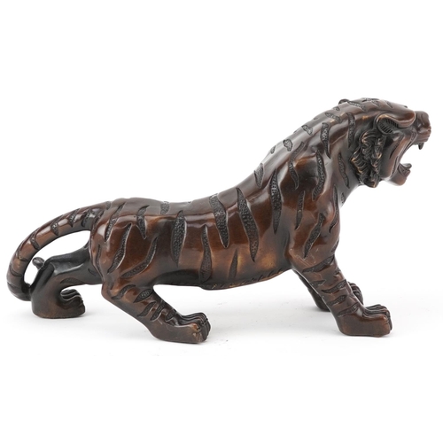 435 - Japanese patinated bronze okimono of a tiger, 35cm in length