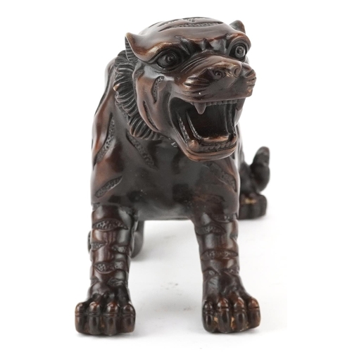 435 - Japanese patinated bronze okimono of a tiger, 35cm in length