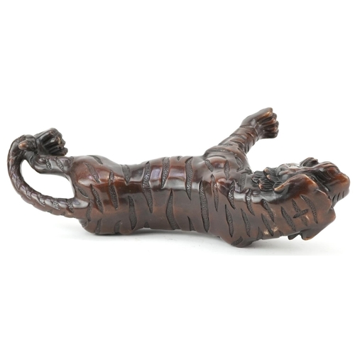 435 - Japanese patinated bronze okimono of a tiger, 35cm in length