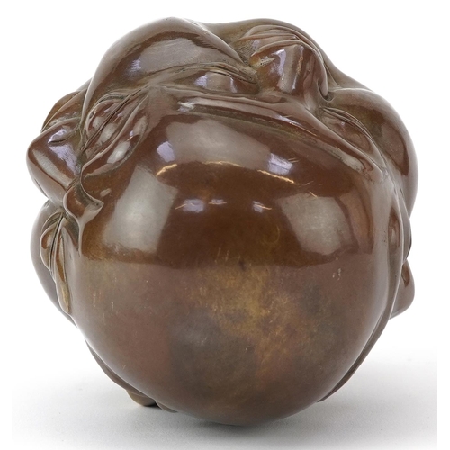 1418 - Chinese patinated bronze four face Buddha paperweight, character marks to the base, 12cm high