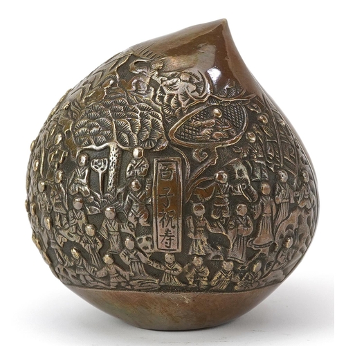 1428 - Chinese bronze paperweight in the form of a peach cast in relief with a continuous and of figures, c... 