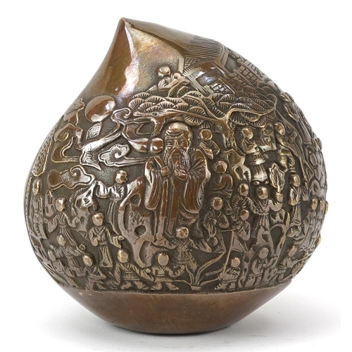 1428 - Chinese bronze paperweight in the form of a peach cast in relief with a continuous and of figures, c... 