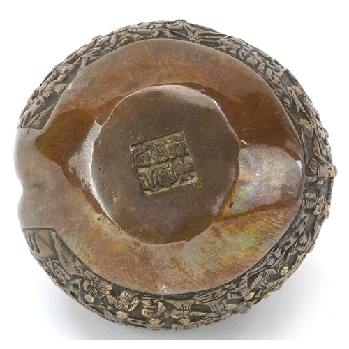 1428 - Chinese bronze paperweight in the form of a peach cast in relief with a continuous and of figures, c... 