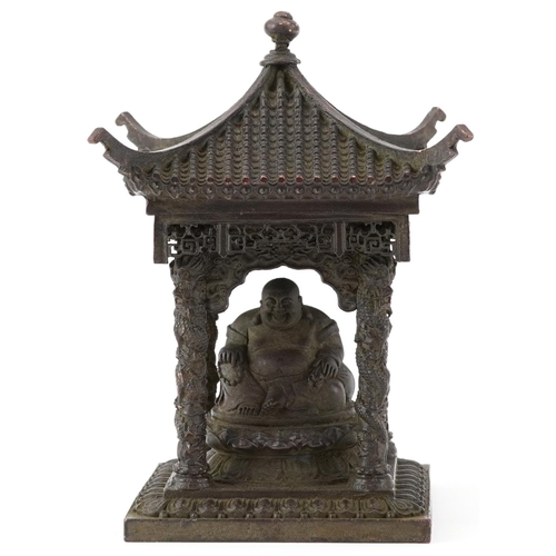 1346 - Chinese patinated bronze study of Buddha seated in a pagoda, 15cm high