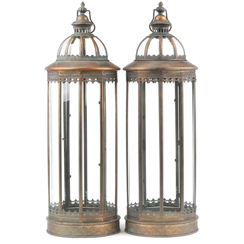 1390 - Large pair of bronzed hanging lanterns with glass panels, 85cm high