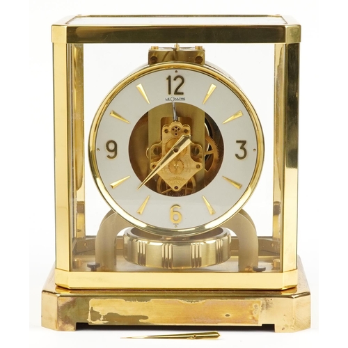 26 - Jaeger LeCoultre brass cased Atmos clock with circular chapter ring having Arabic numerals, serial n... 