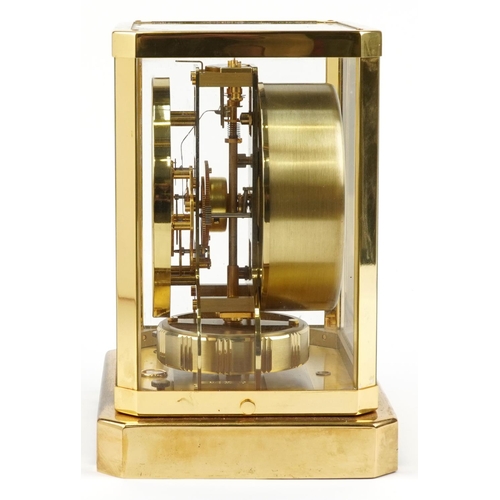26 - Jaeger LeCoultre brass cased Atmos clock with circular chapter ring having Arabic numerals, serial n... 