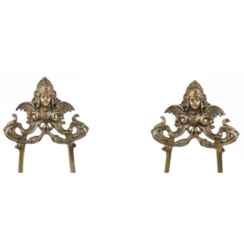 599 - Pair of large Rococo style brass easel stands, 58cm high