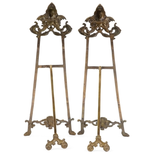 599 - Pair of large Rococo style brass easel stands, 58cm high