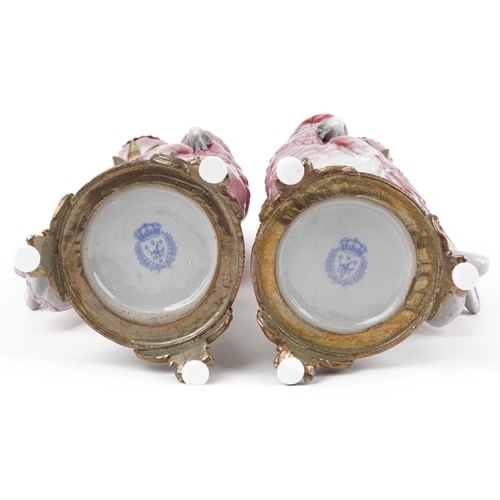 1372 - Pair of continental porcelain Cockatiel and gilt bronze candlesticks, 42cm high