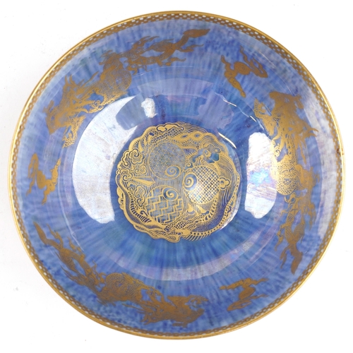 56 - Wedgwood orange and blue ground Fairyland lustre bowl gilded with dragons chasing the flaming pearl ... 