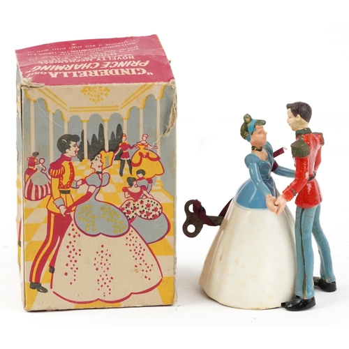 1604 - Vintage clockwork Cinderella and Prince Charming novelty mechanical waltzing figures with box