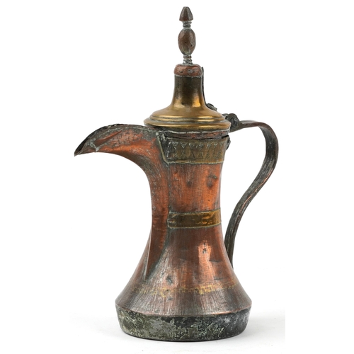 Antique Omani copper and brass dallah coffee pot with foliate engraved bands, 23cm high