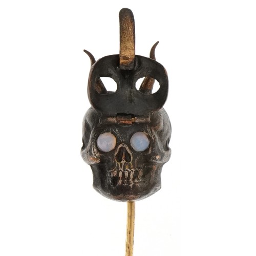 2234 - Antique yellow and white metal stickpin in the form of the devil with hinged mask and opal eyes, 8cm... 