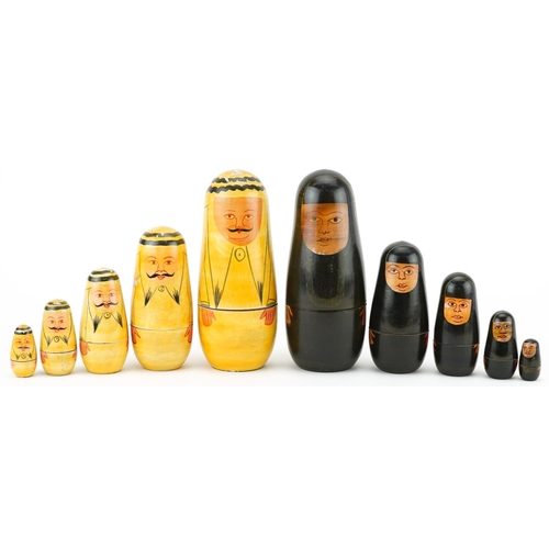 Two vintage Russian lacquered and hand painted wood Matryoshka stacking dolls, each 16cm high