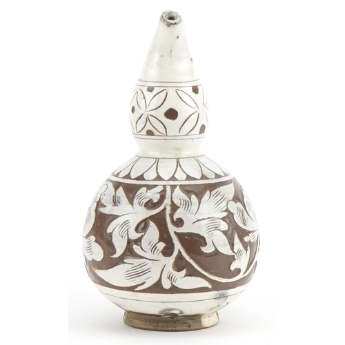 1257 - Chinese porcelain gourd vase having a white glaze incised with flowers, 16.5cm high