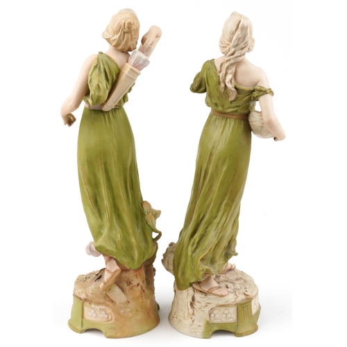 240 - Royal Dux, large pair of Czechoslovakian Art Nouveau figurines of scantily dressed females including... 