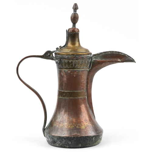 292 - Antique Omani copper and brass dallah coffee pot with foliate engraved bands, 23cm high