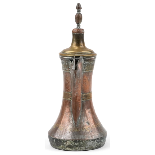 292 - Antique Omani copper and brass dallah coffee pot with foliate engraved bands, 23cm high