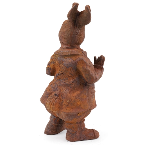 604 - Garden cast iron comical rabbit smoking a pipe, 43cm high