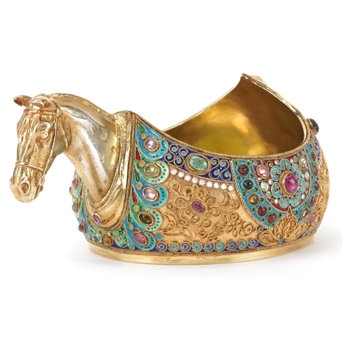 Silver gilt champleve enamel kovsh having a horsehead design handle and set with colourful cabochons, impressed Russian marks to the base, 12cm in length, 350.2g
