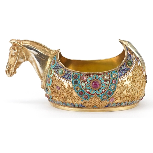 119 - Silver gilt champleve enamel kovsh having a horsehead design handle and set with colourful cabochons... 