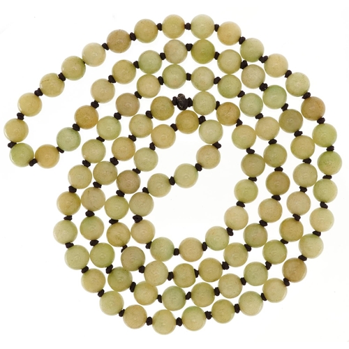 2750 - Chinese green jade bead necklace, 124cm in length, 150.7g