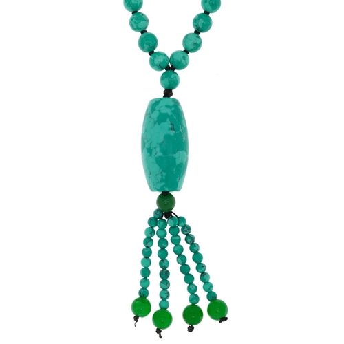 2765 - Turquoise matrix toggle necklace with green jade tassels, 84cm in length, 84.0g