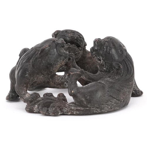 1494 - Chinese patinated bronze of three mythical animals, 6cm in diameter