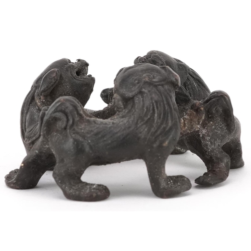 1494 - Chinese patinated bronze of three mythical animals, 6cm in diameter