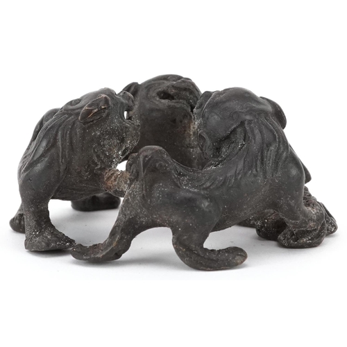 1494 - Chinese patinated bronze of three mythical animals, 6cm in diameter