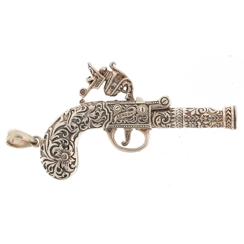 2777 - Sterling silver whistle pendant in the form of a flintlock pistol, 7cm in length, 22.6g