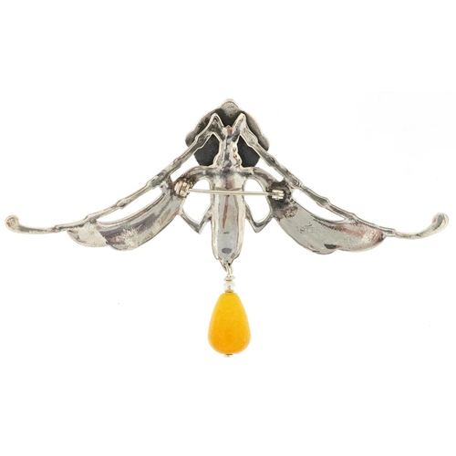 2774 - Egyptian Revival sterling silver brooch with amber coloured drop, 10.5cm wide, 20.2g